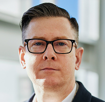 Photo d'Alexander Hughes, PDG d'une entreprise spécialisée dans le trading crypto